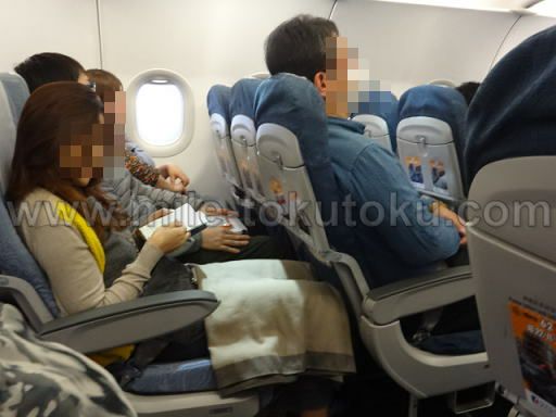 マカオ航空 エコノミークラス 座っている乗客